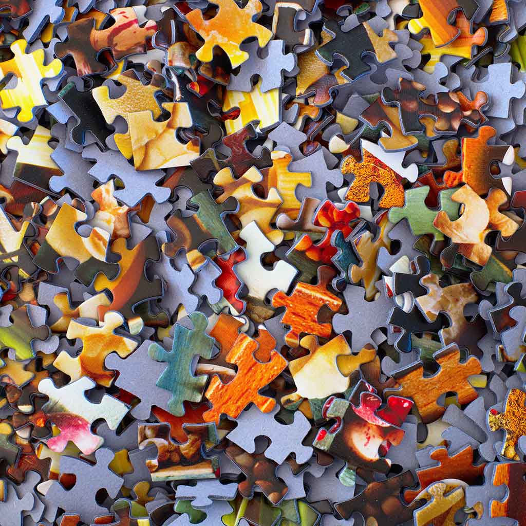 A pile of puzzle pieces that are all together.